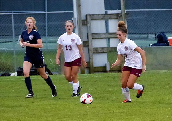 Pictured above during a 2-1 win over West at Oak Ridge High School on Tuesday, Sept. 12, 2017, are freshman Taylor Del Toro (22), center, and senior Zoe Van Hook (17). (Photo by John Huotari/Oak Ridge Today)