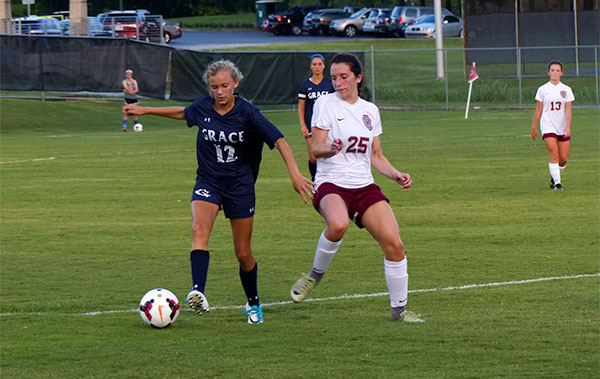 Pictured above trying to stop an attack during a 3-1 win over Grace Christian at Oak Ridge High School on Tuesday, Aug. 29, 2017, is sophomore Katie O'Brien (25). (Photo by John Huotari/Oak Ridge Today)