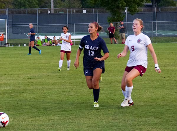 Pictured above racing for the ball during a 3-1 win over Grace Christian at Oak Ridge High School on Tuesday, Aug. 29, 2017, is Rachael Brewer (9). (Photo by John Huotari/Oak Ridge Today)