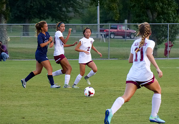 Pictured above on defense during a 3-1 win over Grace Christian at Oak Ridge High School on Tuesday, Aug. 29, 2017, are, from left, sophomores Muskaan Vohra (23) and Jennie Pont Briant (2), and senior Alex Rouse (11). (Photo by John Huotari/Oak Ridge Today)