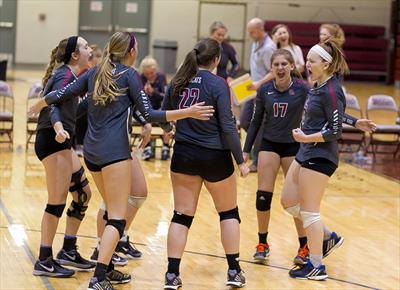 The Oak Ridge Lady Wildcats are pictured celebrating above. (Photo courtesy Oak Ridge High School Volleyball)