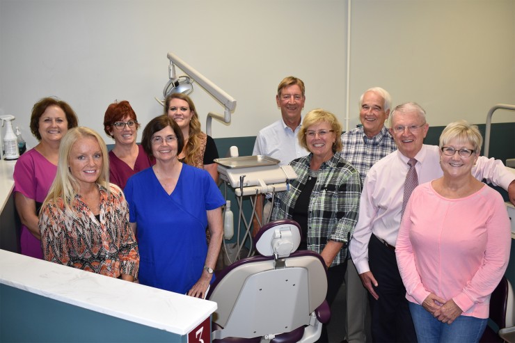 Members of the faculty of Roane State’s dental hygiene program are, from left, director Melinda Gill, Kimball Burkett, standing to Gill’s left; and from left, Kellye Wilson, Sondra Roberts, Natalie Schubert, Wesley Singer, DDS; Michelle Jones, Pete Ruyl, DDS; Ed Guion, DDS; and Debbie Taylor. Schubert is the receptionist for the program’s dental clinic. (Photo by Roane State)