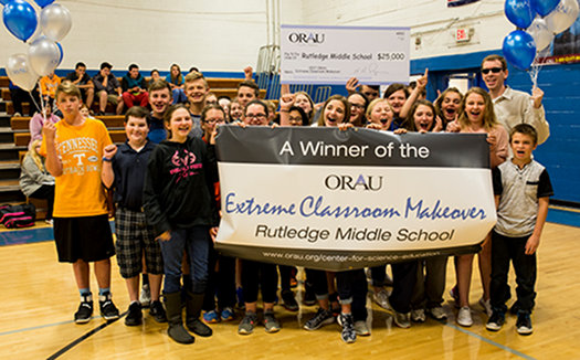 A photo of last year’s winner in the ORAU Extreme Classroom Makeover contest, Kyle Roach, a seventh-grade teacher at Rutledge Middle School, with some of the school’s students. (Photo by ORAU)