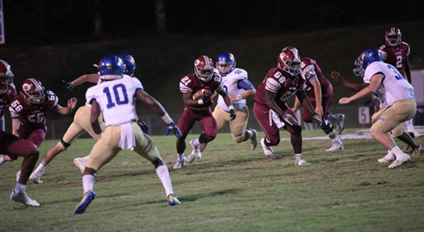 Oak Ridge sophomore Tyrell Romano (21) ran for 100 yards on 15 carries and one touchdown during a 49-3 homecoming win for the Wildcats on Blankenship Field on Friday, Sept. 29, 2017. Blocking here are sophomore Matthew Calhoun (56) and senior Ramar Hawkins (66). (Photo by Luther Simmons)
