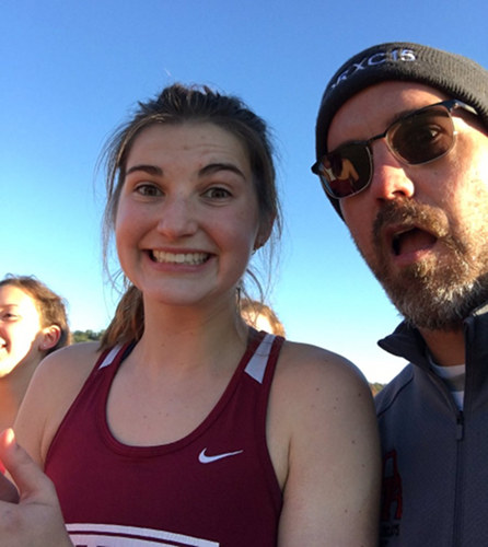 Oak Ridge senior captain Robyn Wood, who will be an alternate in the girls state cross country meet in Nashville on Saturday, Nov. 4, 2017, is pictured above with assistant coach Tom Sauer at the Region 2 Large Division meet at Victor Ashe Park in Knoxville on Thursday, Oct. 26. (Photo courtesy Oak Ridge High School Cross Country/Robyn Wood)