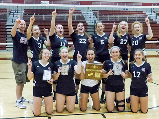 The Oak Ridge Lady Wildcats celebrate after winning the District 4-AAA volleyball championship in Wildcat Arena on Tuesday, Oct. 3, 2017. (Photo by John Huotari/Oak Ridge Today)
