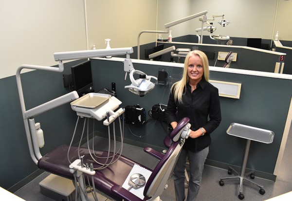 Roane State dental hygiene program director Melinda Gill stands in the collegeâ€™s state-of-the-art dental clinic at the Oak Ridge campus. (Photo by Roane State)
