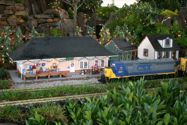 Holiday Express at the Children’s Museum of Oak Ridge will feature G-scale model trains and a miniature village decorated for the holidays. Here, a CSX model train passes the train station, ready for the holidays. (Submitted photo)