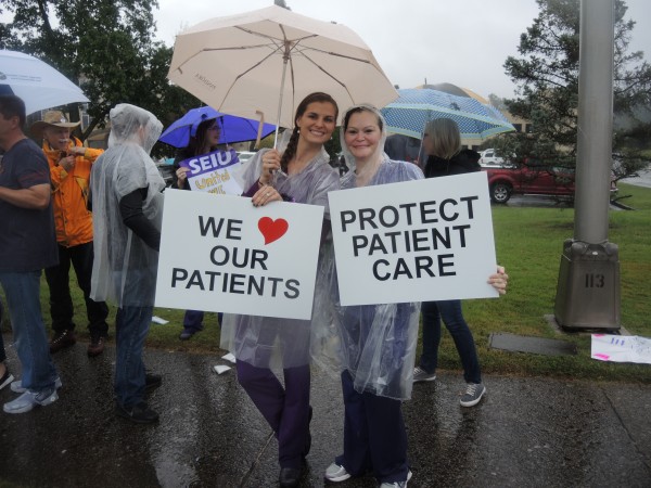 Members of Service Employees International Union Local 205 rallied in front of Methodist Medical Center during a heavy rain on Sunday, Oct. 8, 2017, to protest the state of negotiations on a new three-year contract. The rally included about 150 people, and the crowd stretched over a block. (Photo submitted by SEIU)