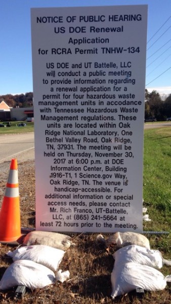 A roadside sign posted near the intersection of Scarboro Road and Bethel Valley Road announces a meeting on Nov. 30, 2017, for the renewal of a hazardous waste permit for the U.S. Department of Energy/UT-Battelle at Oak Ridge National Laboratory.