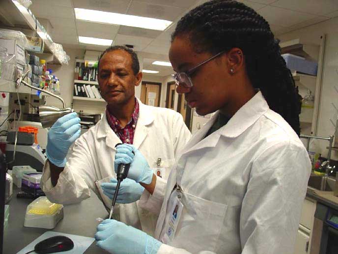 Chemistry student Kayla Bailey, right, and Associate Professor Matthewos Eshete spent their summer at Kansas State University in the U.S. Department of Homeland Security Summer Research Team (SRT) Program. They studied biodegradable nanoparticlesâ€™ interactions with proteins in the body to help design more effective vaccines and drug delivery systems, among other applications. (Photo courtesy ORISE/ORAU)