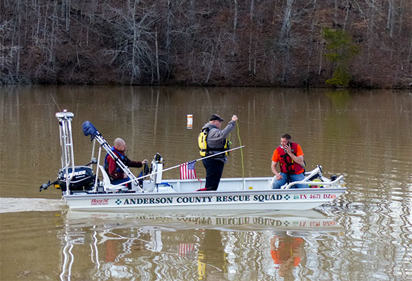 Rescuers in an Anderson County Rescue Squad boat search for a missing man in the water at Bull Run Park in Claxton, authorities said Sunday afternoon, Feb. 18, 2018. At center is Rescue Squad Chief Terry Allen. (Photo by John Huotari/Oak Ridge Today)