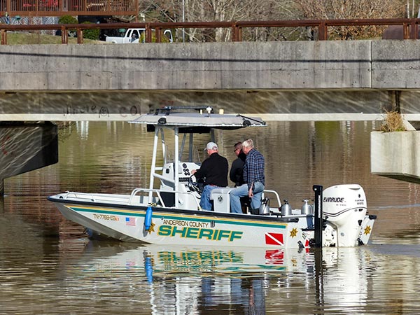 Rescuers in an Anderson County Sheriff's Department boat search for a missing man in the water at Bull Run Park in Claxton, authorities said Sunday afternoon, Feb. 18, 2018. Anderson County Sheriff Paul White is at right in the boat. (Photo by John Huotari/Oak Ridge Today)