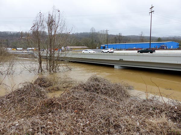 Flood waters from Indian Creek flow under East Tri County Boulevard in Oliver Springs on Sunday, Feb. 11, 2018. (Photo by John Huotari/Oak Ridge Today)