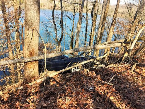 No injuries were reported after a car crashed off the side of the road above the Clinch River on Melton Lake Drive near Rivers Run Boulevard on Friday afternoon, Feb. 2, 2018, authorities said. (Photo by Oak Ridge Police Department)