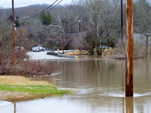 Flood waters from Indian Creek closed Midway Drive in Oliver Springs on Sunday, Feb. 11, 2018. (Photo by John Huotari/Oak Ridge Today)