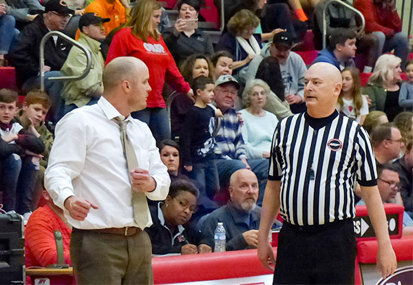 Oak Ridge Coach Aaron Green talks to an official during a District 3-AAA semifinal game against Anderson County at Halls on Friday, Feb. 16, 2018. (Photo by John Huotari/Oak Ridge Today)