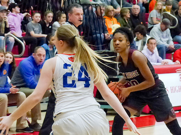 Oak Ridge pulled away from Campbell County in the second half to win its third straight district championship, 60-38, in the girls' basketball tournament at Halls on Saturday, Feb. 17, 2018. Pictured above is Oak Ridge senior Desiree Bates (20). (Photo by John Huotari/Oak Ridge Today)