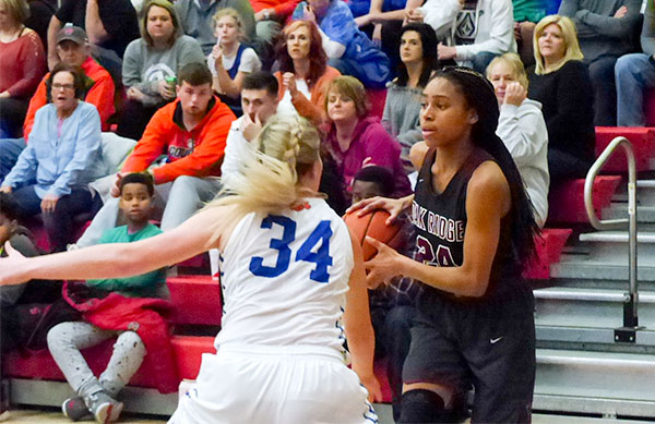 Oak Ridge pulled away from Campbell County in the second half to win its third straight district championship, 60-38, in the girls' basketball tournament at Halls on Saturday, Feb. 17, 2018. Oak Ridge junior Jada Guinn (24), who was named most valuable player of the tournament, led in scoring with 23 points. (Photo by John Huotari/Oak Ridge Today)