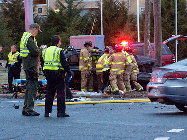 The Oak Ridge Fire Department helps rescue four people entrapped in an SUV involved in a fatal two-vehicle crash at Emory Valley Road and Lafayette Drive on Friday evening, Jan. 13, 2017. Six people, including two children and four adults, were injured. The back of a Volkswagen sedan involved in the crash is pictured at right. (Photo by John Huotari/Oak Ridge Today)