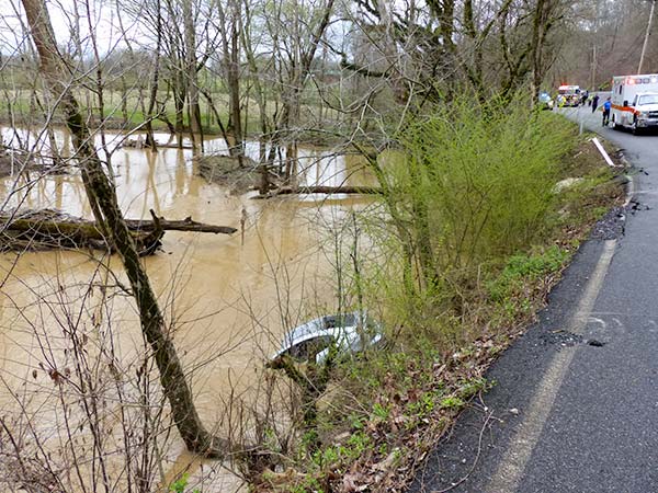 A 50-year-old Rocky Top man died when a 2006 Mazda car crashed off Poplar Creek Road and into Poplar Creek just north of west Oak Ridge late Tuesday morning, authorities said. (Photo by John Huotari/Oak Ridge Today)