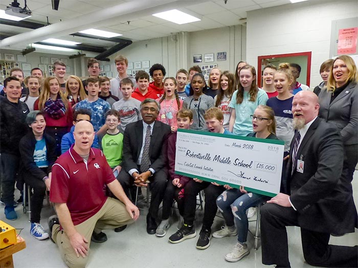 Robertsville Middle School in Oak Ridge is the first middle school to ever be selected for a NASA program that launches small cube-shaped satellites into space. On Friday, March 9, 2018, the $70,000 science project got a $15,000 boost from Oak Ridge National Laboratory. Celebrating above by saying "NASA, we are a go!" are RMS students, teacher Todd Livesay, ORNL Director Thomas Zacharia, Oak Ridge Schools Superintendent Bruce Borchers, and other Oak Ridge Schools staff and project volunteers. (Photo by John Huotari/Oak Ridge Today)