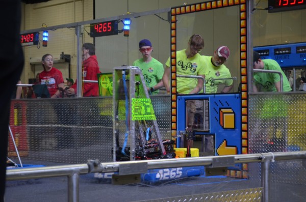The Secret City Wildbots compete in the Palmetto Regional FIRST Robotics competition on Friday, March 2, 2018. Pictured above, Mantis, the robot, loads a cube for a powerup. (Photo by Angi Agle)