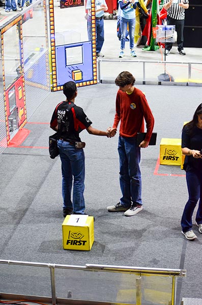 After a regional alliance win at the University of Tennessee in Knoxville on Saturday, March 24, 2018, the Secret City Wildbots robotics team of Oak Ridge, Team 4265, is headed to the World Finals in Houston in April. Pictured above is Eric Thornton of Oak Ridge accepting the invitation to join what would become the winning alliance with the number one-ranked team (2614, MARS of Morgantown, W.V.). (Photo by Sara Agle)