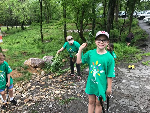 Pictured above is Carleigh Brown, a fifth-grade student at Robertsville Middle School who helped on the Baker Creek Preserve project last year in Knoxville. This year's Comcast Cares Day is at Robertsville Middle School in Oak Ridge on Saturday, April 21, 2018. (Submitted photo)
