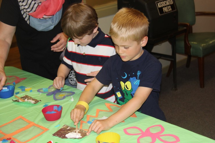 Children enjoy making crafts to take home at the Celebration of the Young Child at the Children's Museum of Oak Ridge. (Submitted photo)