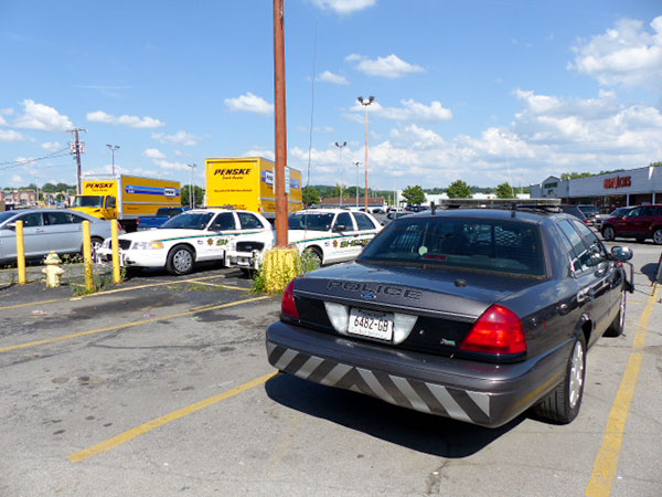The law enforcement search at McGuire—a store that sells used books, compact discs, digital video discs, and electronics—is expected to last hours and continue throughout the night Thursday May 24, 2018. There were law enforcement vehicles and several moving trucks parked in front of the store Thursday afternoon. (Photo by John Huotari/Oak Ridge Today)