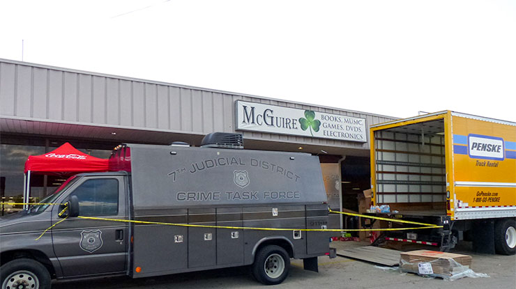 The law enforcement search at McGuire—a store that sells used books, compact discs, digital video discs, and electronics—is expected to last hours and continue throughout the night Thursday May 24, 2018. (Photo by John Huotari/Oak Ridge Today)