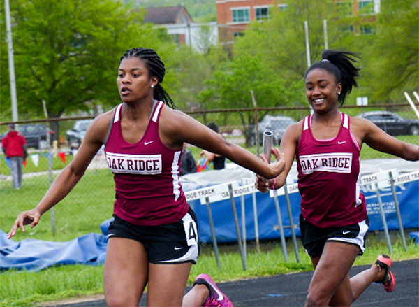 Pictured above during an April 24 track meet at Oak Ridge are juniors Shatyrah Copeland, left, and Makiya Garrett, who who qualified for the state track and field championship in Murfreesboro on Thursday, May 24, 2018, as part of the girls 4x100-meter relay team. (Photo by John Huotari/Oak Ridge Today)