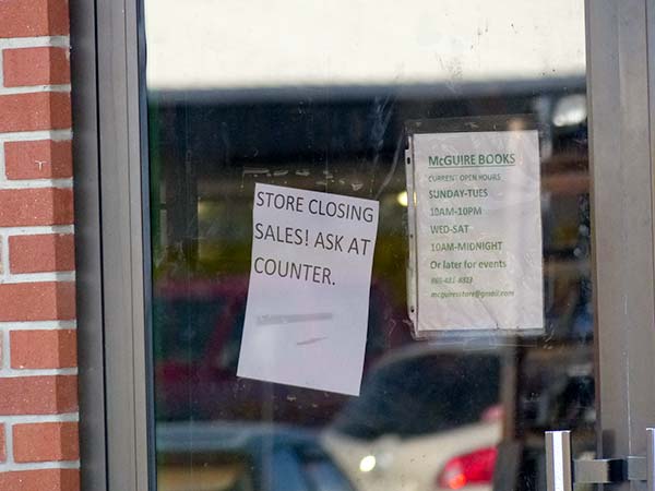 A sign on the door of McGuire Books in Oak Ridge announces store closing sales. This photo was taken Friday, June 1, 2018. (Photo by John Huotari/Oak Ridge Today)