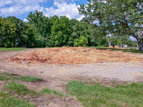 After a years-long dispute over alleged code violations, the 13 Applewood Apartments buildings on Hillside Road and Hunter Circle have been demolished. This picture was taken looking east from Highland Avenue over the site of three former buildings at Hillside Road on Monday, July 9, 2018. (Photo by John Huotari/Oak Ridge Today)