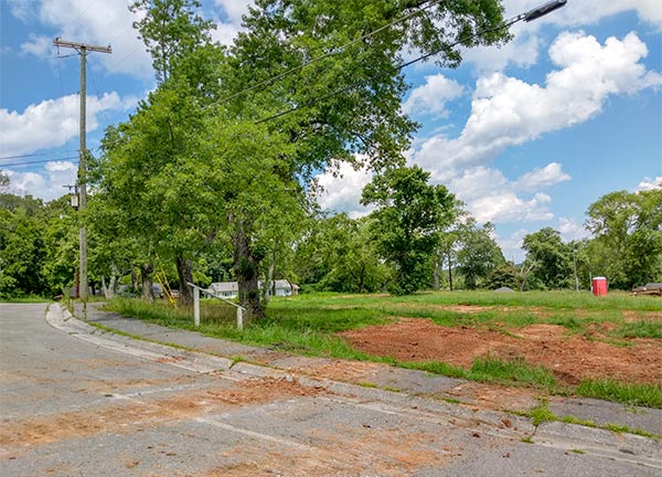 After a years-long dispute over alleged code violations, the 13 Applewood Apartments buildings on Hillside Road and Hunter Circle have been demolished. This picture was taken looking east from West Hunter Circle over the site of several former buildings on Monday, July 9, 2018. (Photo by John Huotari/Oak Ridge Today)