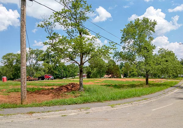 After a years-long dispute over alleged code violations, the 13 Applewood Apartments buildings on Hillside Road and Hunter Circle have been demolished. This picture was taken looking south-southeast from West Hunter Circle over the site of several former buildings on Monday, July 9, 2018. (Photo by John Huotari/Oak Ridge Today)