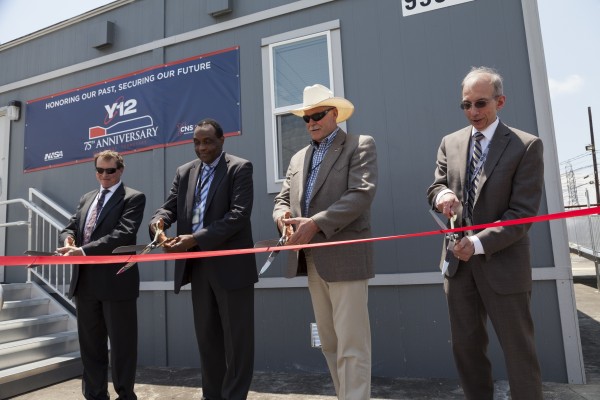 Officials cut the ribbon June 11, 2018, to open the NBL Center, a new building and nuclear security mission for the Y-12 National Security Complex. From left to right are Joe McBrearty, deputy director of field operations, U.S. Department of Energy Office of Science; Yacouba Diawara, NBL Program Office director; Geoff Beausoleil, National Nuclear Security Administration Production Office Manager; and Morgan Smith, Consolidated Nuclear Security president and chief executive officer. (Photo courtesy NNSA/Y-12)