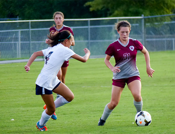 Oak Ridge sophomore Katelyn Mattus (31) is pictured above with freshman Lexi Foley (4) of Farragut during a 5-2 win for the Lady Wildcats at home on Tuesday, Aug. 21, 2018. (Photo by John Huotari/Oak Ridge Today) 