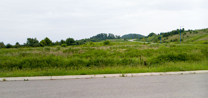 A large ridge top tract of land that features panoramic views and was once proposed as the site of a Target retail development is now for sale. The land, which is also known as The Summit, is on Pine Ridge along South Illinois Avenue between Scarboro Road/Lafayette Drive and Centrifuge Way. It's pictured above on Wednesday, Aug. 15, 2018. (Photo by John Huotari/Oak Ridge Today)