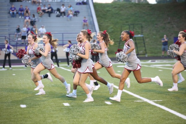 Oak Ridge Wildcats cheerleaders run onto the field at Sevier County during a 41-13 win over the Smoky Bears on Friday, Sept. 21, 2018. (Photo by Luther Simmons)