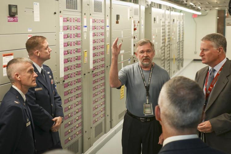 To extend its weather modeling capabilities, the U.S. Air Force has joined the computing experts at the U.S. Department of Energy’s Oak Ridge National Laboratory in a strategic collaboration that includes procurement and operation of a new high-performance weather modeling computer system. Key members of the Air Force and ORNL teams gathered on July 10, 2018, to kick off the project and tour the facilities supporting the new system. (Photo courtesy ORNL) 