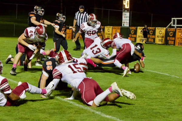 The Oak Ridge red-zone defense is pictured above as Clinton fumbles during a 54-28 win at Clinton on Friday, Oct. 12, 2018. (Photo by Barry Houchin)
