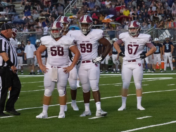 Pictured above are members of the Oa Ridge defensive line, Izaiah Boone (58), Timothy Johnson Jr. (59), and Sam Hensley (67), at Hardin Valley on Aug. 16, 2018. (Photo by John Huotari/Oak Ridge Today)