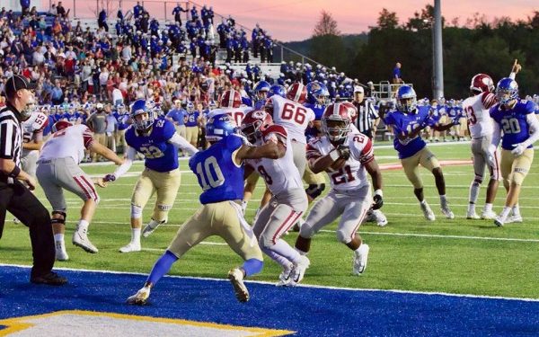 Oak Ridge junior Tyrell Romano (21) runs for a touchdown behind a block by senior Jordan Graham (8) during a 48-7 win at Karns on Friday, Sept. 28, 2018. (Photo by Barry Houchin)
