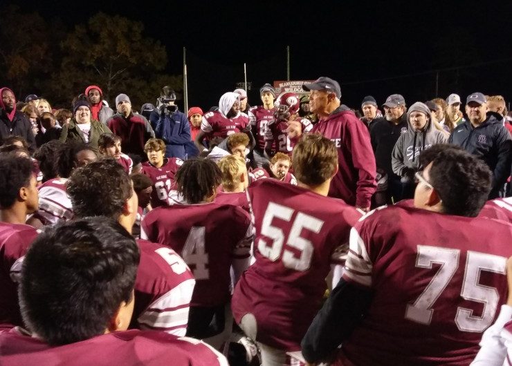 Oak Ridge shut out Rhea County 42-0 in a first-round Class 5A playoff game on Blankenship Field on Friday, Nov. 2, 2018. Above, coach Joe Gaddis talks to the Wildcats after the game. (Photo by John Huotari/Oak Ridge Today)