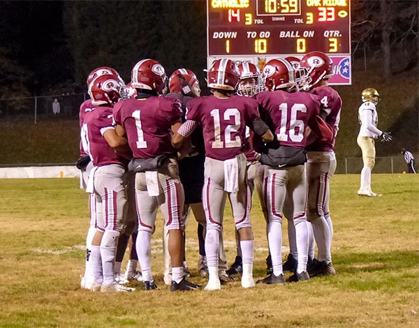 The Oak Ridge Wildcats huddle during a 42-40 loss to Catholic in a Class 5A quarterfinal game on Blankenship Field on Friday, Nov. 16, 2018. (Photo by John Huotari/Oak Ridge Today)