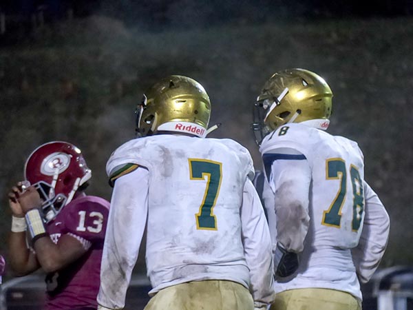 Catholic junior linemen Stiles Moore (7) and Cooper Mays (78) pressure Oak Ridge senior quarterback Herbert Booker (13) in the backfield during a 42-40 win for the Fighting Irish in a Class 5A quarterfinal game on Blankenship Field on Friday, Nov. 16, 2018. (Photo by John Huotari/Oak Ridge Today)