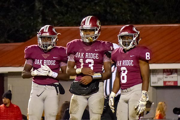 Pictured above from left during a 42-40 loss to Catholic in a Class 5A quarterfinal game on Blankenship Field on Friday, Nov. 16, 2018, are sophomore Jonathan Stewart (2), senior Herbert Booker (13), and senior Jordan Graham (8). (Photo by John Huotari/Oak Ridge Today)