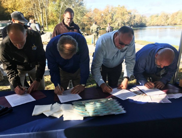 The Tennessee Valley Authority and the U.S. Fish and Wildlife Service have reached a multi-agency agreement to provide continued funding for three federal fish hatcheries that have stocked waters in Georgia and Tennessee with millions of trout. The agreement was announced Tuesday, Oct. 30, 2018, at a press conference beside the Clinch River below Norris Dam. The partnership, which began in 2013, includes the Tennessee Wildlife Resources Agency and the Georgia Department of Natural Resources. (Photo courtesy Tennessee Valley Authority)